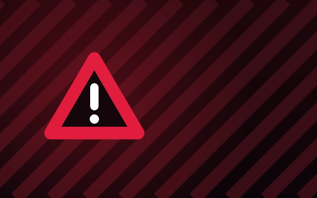 A red warning triangle with an exclamation mark on a dark striped background